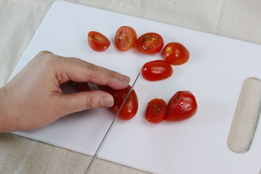 Cutting cherry tomatoes at a 45 degree angle