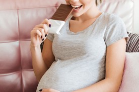 Pregnant woman eating chocolate moderately benefits