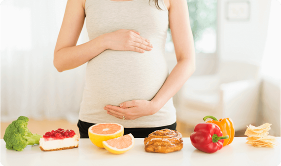 Pregnant woman with a mix of cravings lined up infront of her