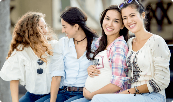 Pregnant woman hanging out with her friends