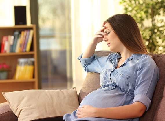 Pregnant woman experiencing morning sickness