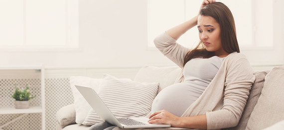 Pregnant woman searching tips on choosing confinement centres
