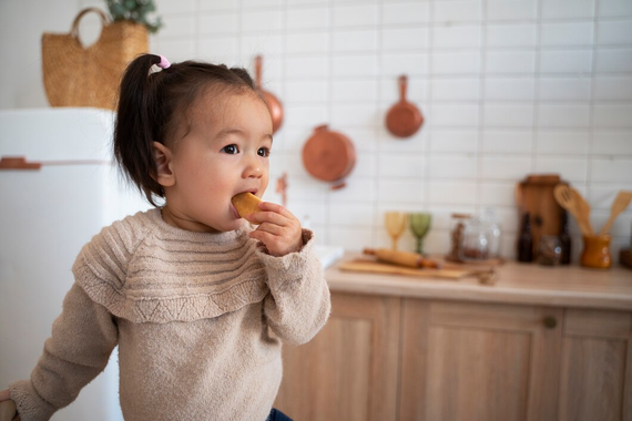 Toddler eating a cookie