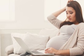 Pregnant woman searching tips on choosing confinement centres