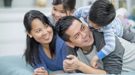 Parents playing with two children