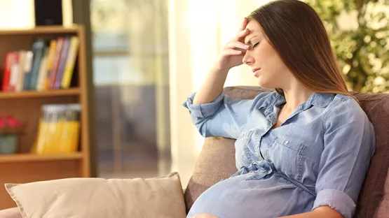 Pregnant woman experiencing morning sickness