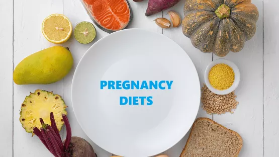 Plate surrounded by healthy food for pregnancy diet