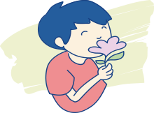 A child using his sense of smell to pick up on the scent of a flower